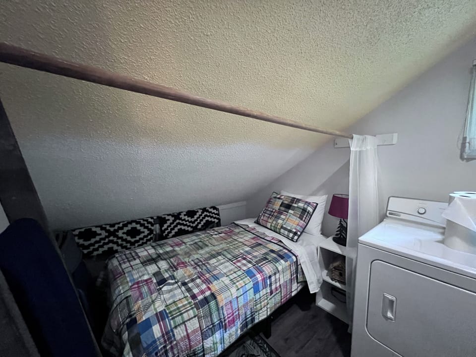 Twin bed in Laundry