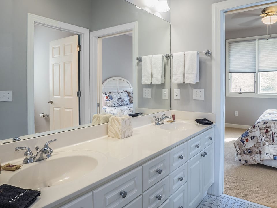 Double sinks in Jack and Jill for bathroom for guest bedrooms 1 and 2.