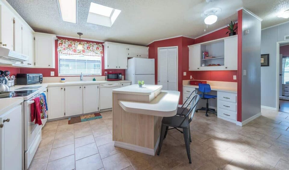 The large open kitchen allows for many helpers or just provides a great space to move around freely while visiting or preparing meals.