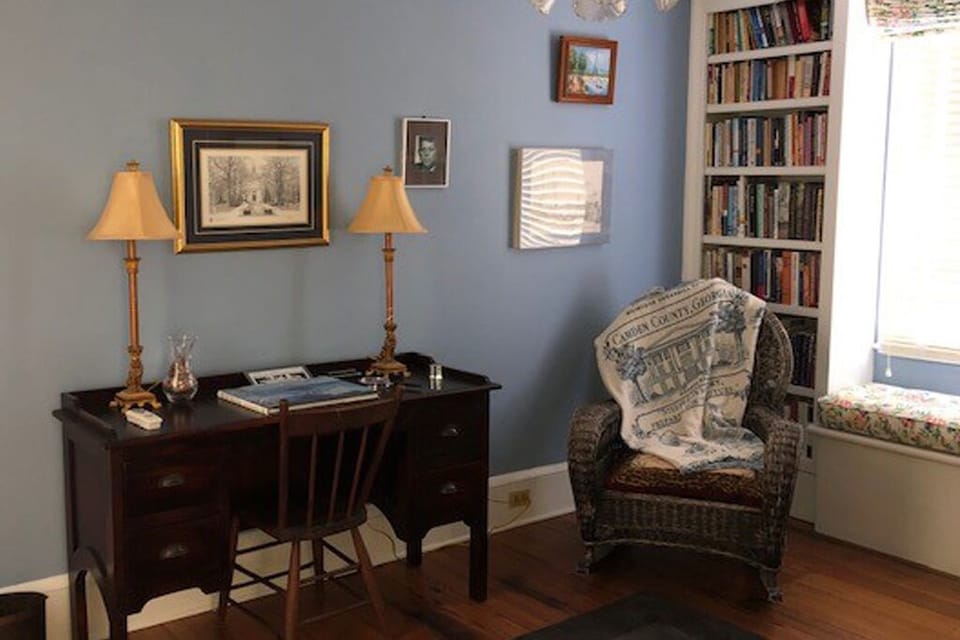 Library adjacent to Burr Bedroom, with a writing desk and comfy antique rocker.