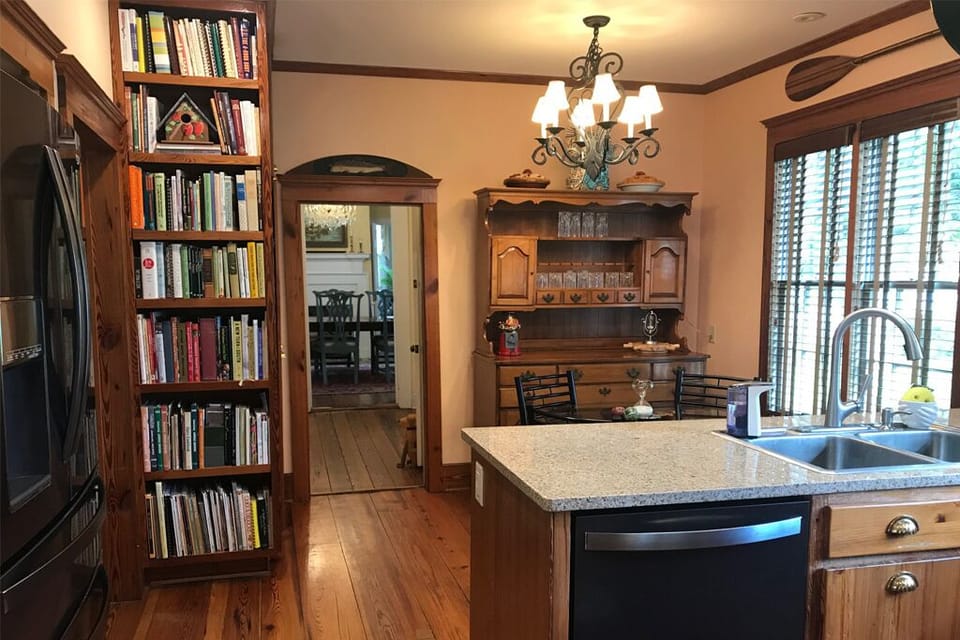The kitchen highlights a fantastic collection of cookbooks. Try a new recipe?