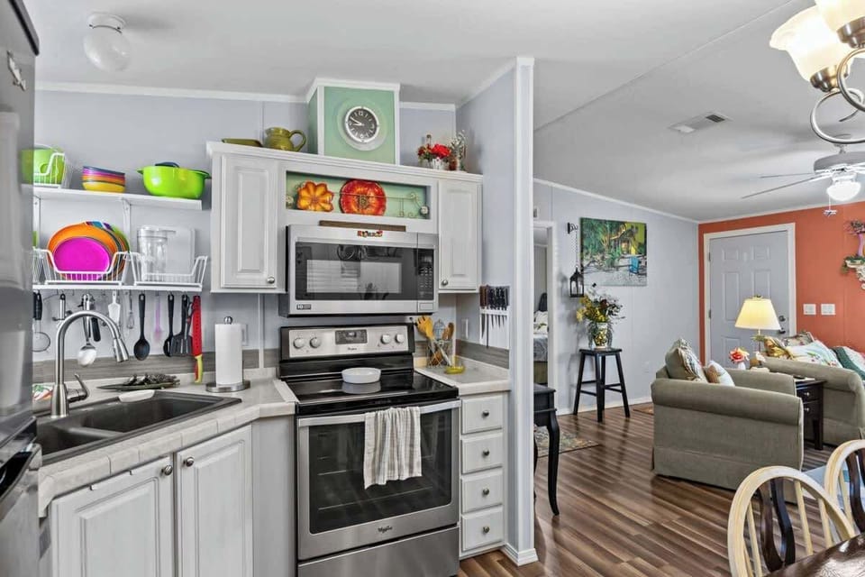 ‍ The Open Kitchen Keeps The Cook Connected With Family Nearby ‍‍‍. 
A Full New Microwave And Sleek Flat-Top Stove ️ Make Mealtime Feel Effortless And Fun—Just Like Home .