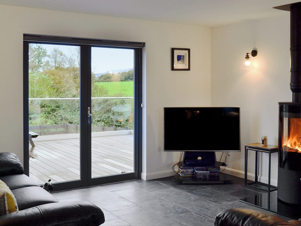 Comfortable living area with cosy wood burner | Thistlebank, Banton, near Kilsyth