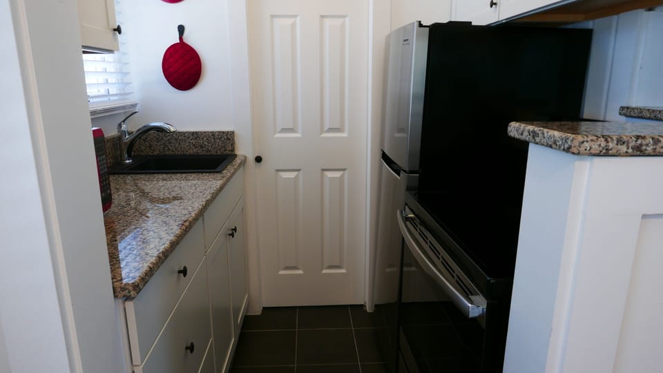 Full kitchen with small dishwasher, oven, microwave, and much more.