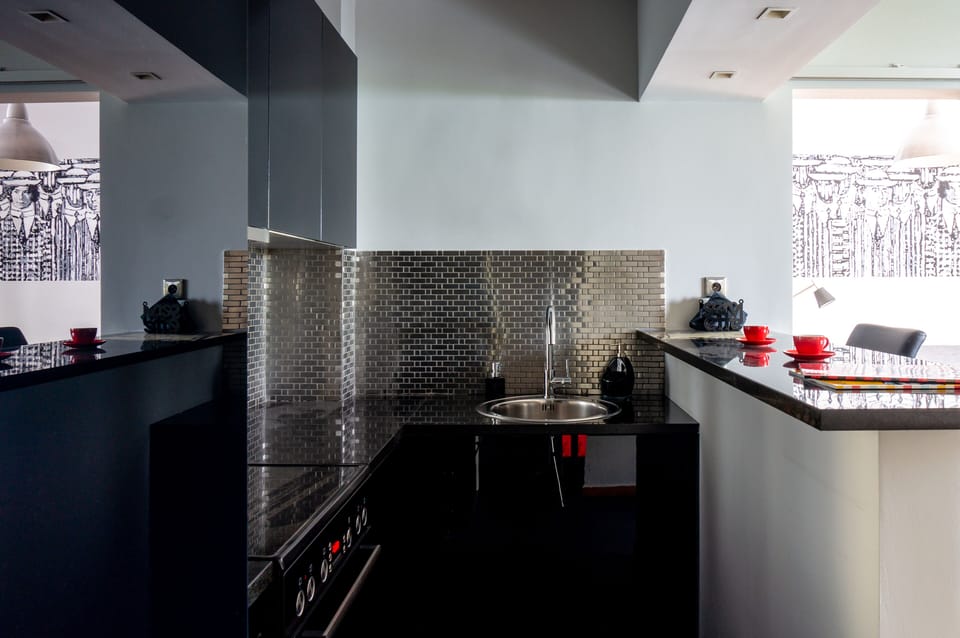 View of kitchen with living room in background
