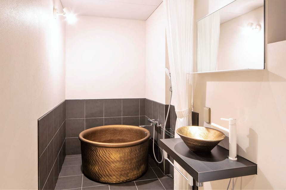 Deluxe Twin Room (with Japanese Style Room) | Bathroom | Combined shower/tub, free toiletries, hair dryer, bathrobes