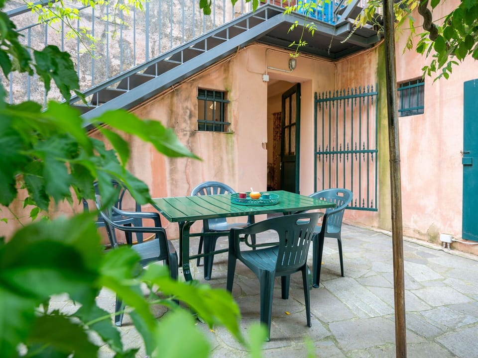 Furniture, Outdoor Table, Outdoor Furniture, Chair, Iron, Wood Stain, Shade, Backyard, Houseplant, Yard