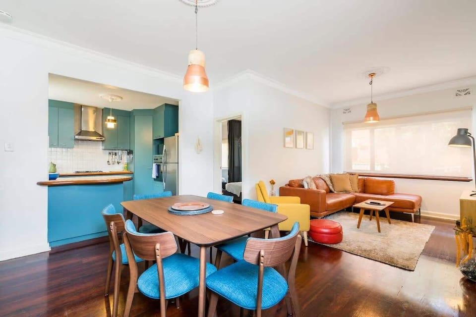 Unwind on the comfortable leather sofa and gather for meals in the spacious dining area. A welcoming space for everyone.