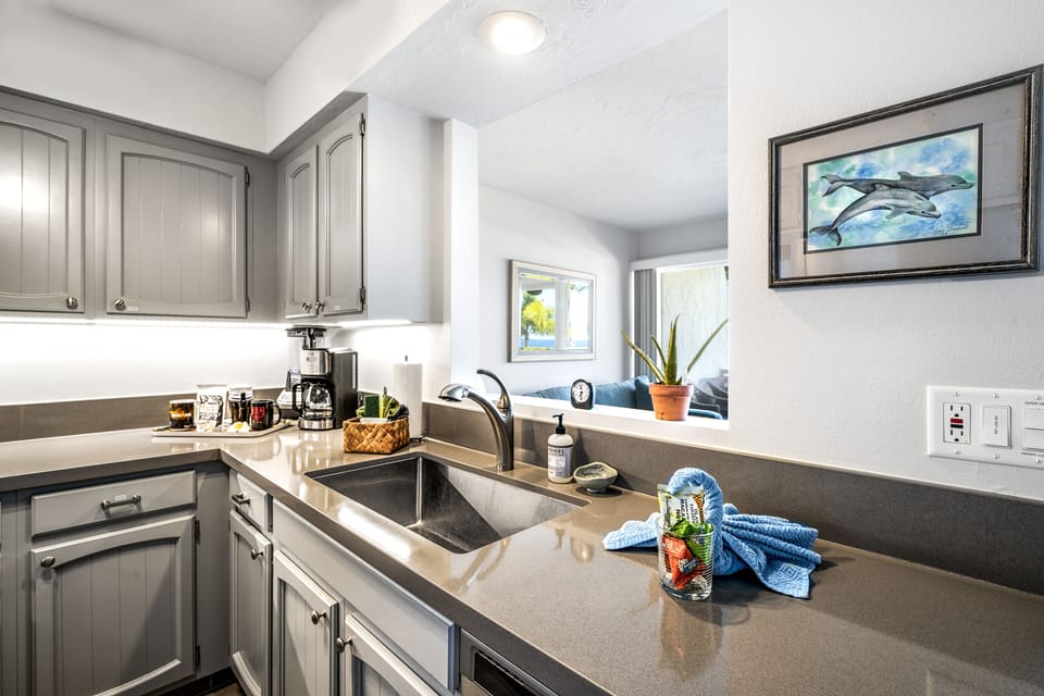 Whip up snacks or meals with ease on spacious solid-surface countertops.