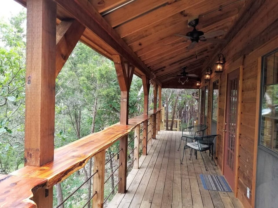 Porch View from BBQ Station. 2 Ceiling Fans, Seating, Handcrafted Railing & View