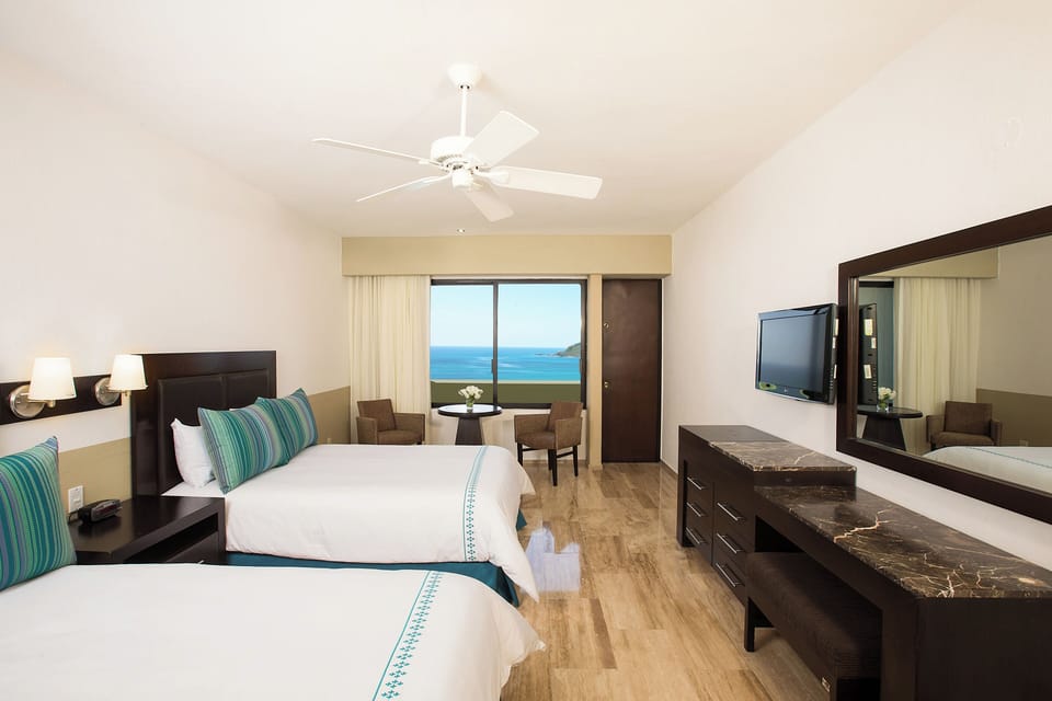 Standard Ocean View | Premium bedding, in-room safe, iron/ironing board