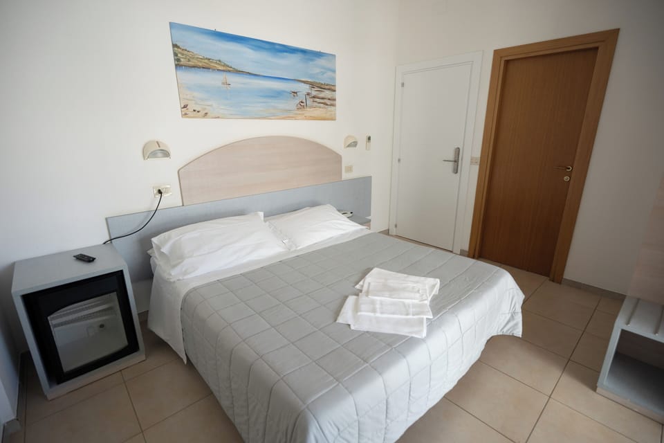 Standard Double or Twin Room | Minibar, in-room safe, desk, laptop workspace