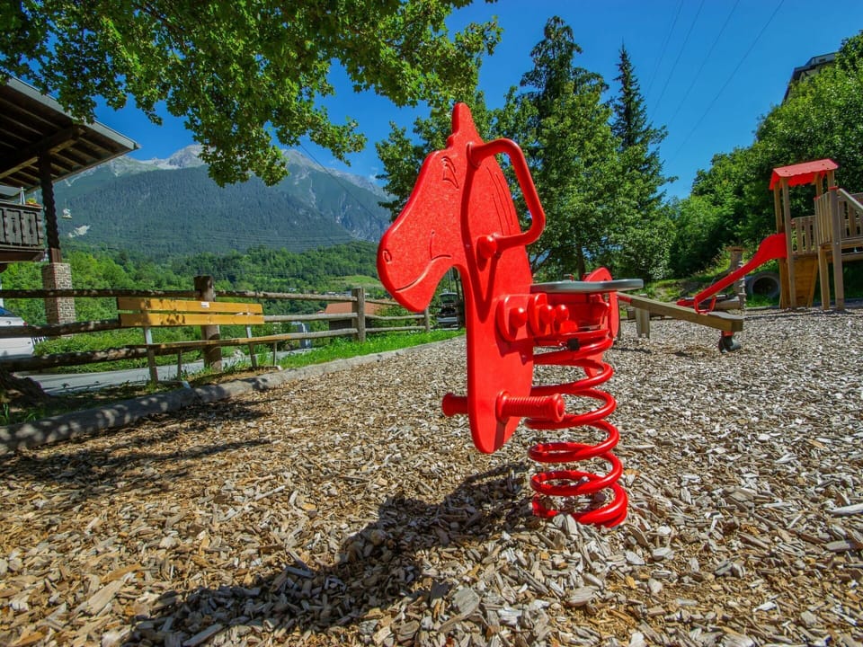 Playground, Red, Public Space, Human Settlement, Tree, Soil, City, Vehicle, Rural Area