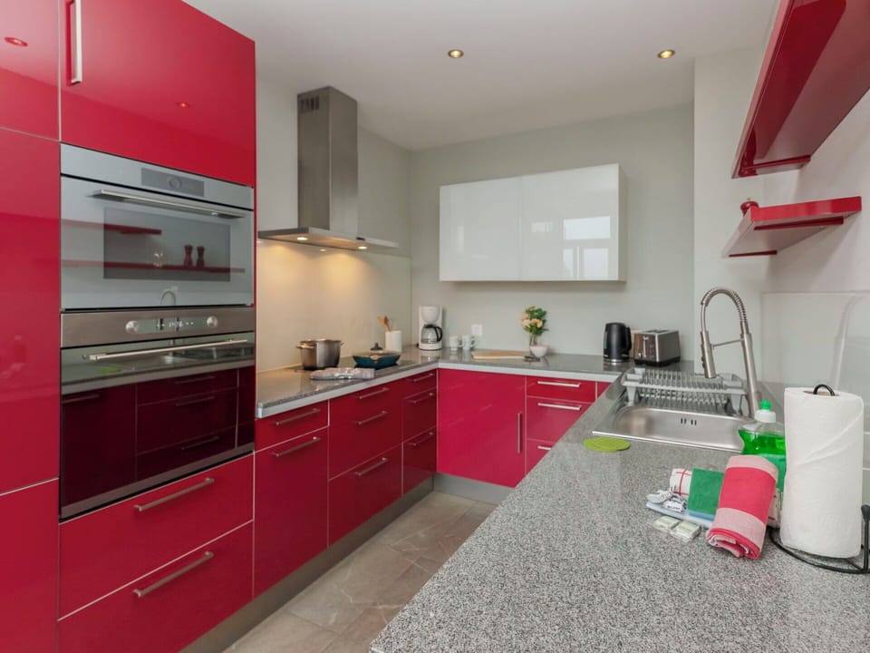 Kitchen, Countertop, Kitchen Appliance, Cabinetry, Interior Design, Major Appliance, Flooring, Furniture, Kitchen Stove, Floor
