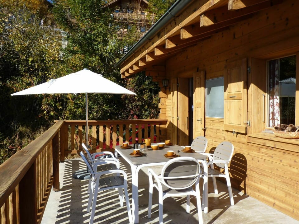 Furniture, Property, Chair, Building, Table, Shade, Tree, Wood, Outdoor Furniture, Outdoor Table