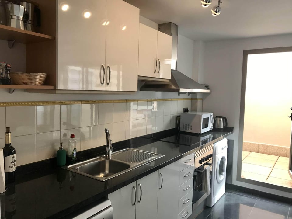 Dishwasher, washing machine, outdoor drying area off the kitchen.