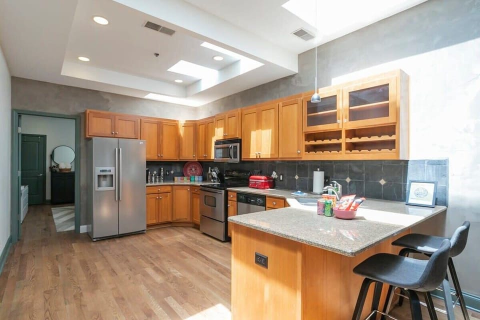 Open Kitchen stocked with cookware essentials and natural light from the skylights. Drip coffee machine!