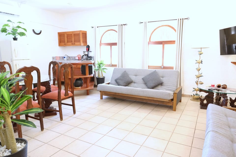 Bosque Caribe One Bedroom Apartment with Terrace | Living room | 42-cm flat-screen TV with cable channels, Netflix, streaming services