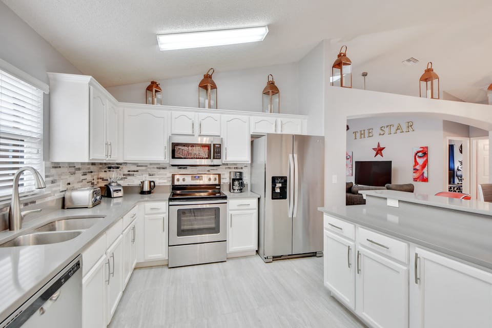 Full kitchen with stainless steel appliances 