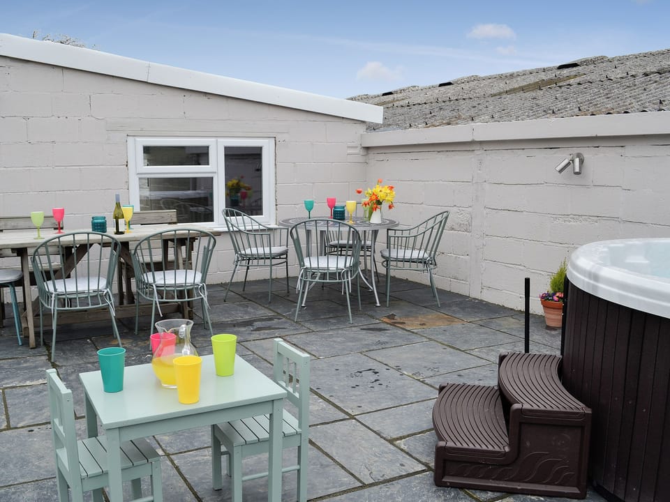 Hot tub and patio with dining area | Bryn Boda, Nantglyn, near Denbigh