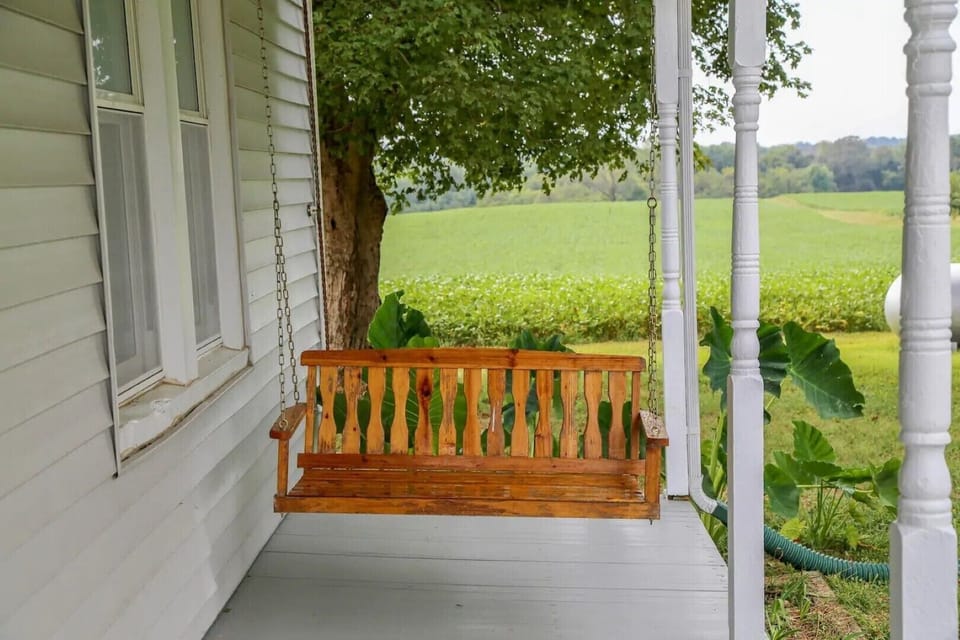 The porch swing is a great place to relax, read and enjoy the peaceful setting