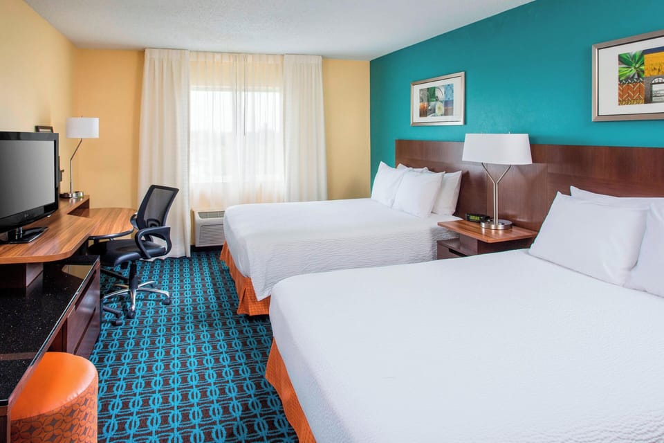 Room, 2 Queen Beds | Desk, iron/ironing board, free cribs/infant beds, free rollaway beds