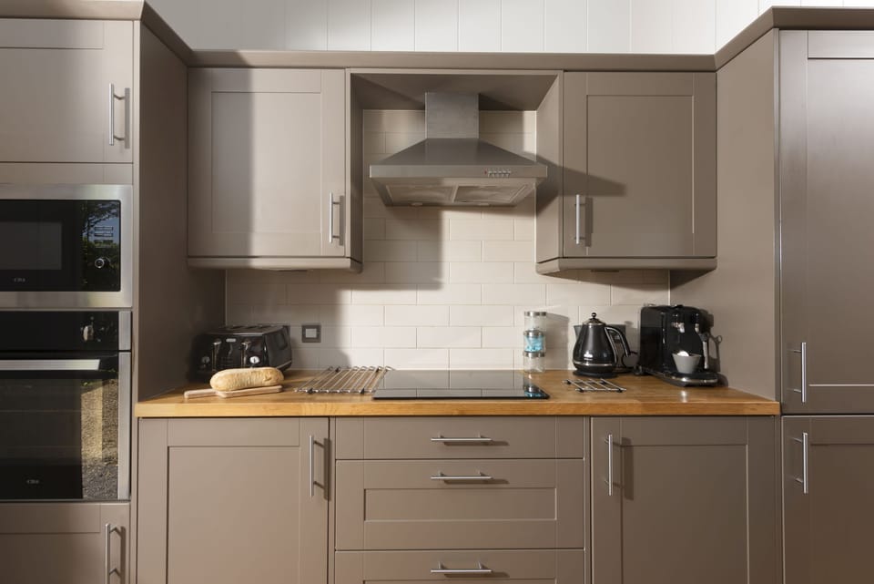 Kitchen with oven and hob, toaster, and kettle - Diamond Lodge, Strawberryfield Park