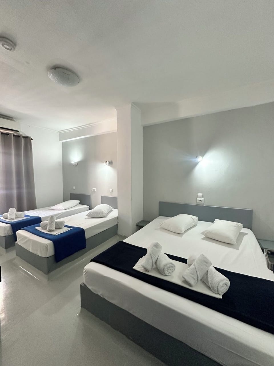Basic Quadruple Room, 1 Bedroom | Blackout drapes, iron/ironing board, free WiFi, bed sheets
