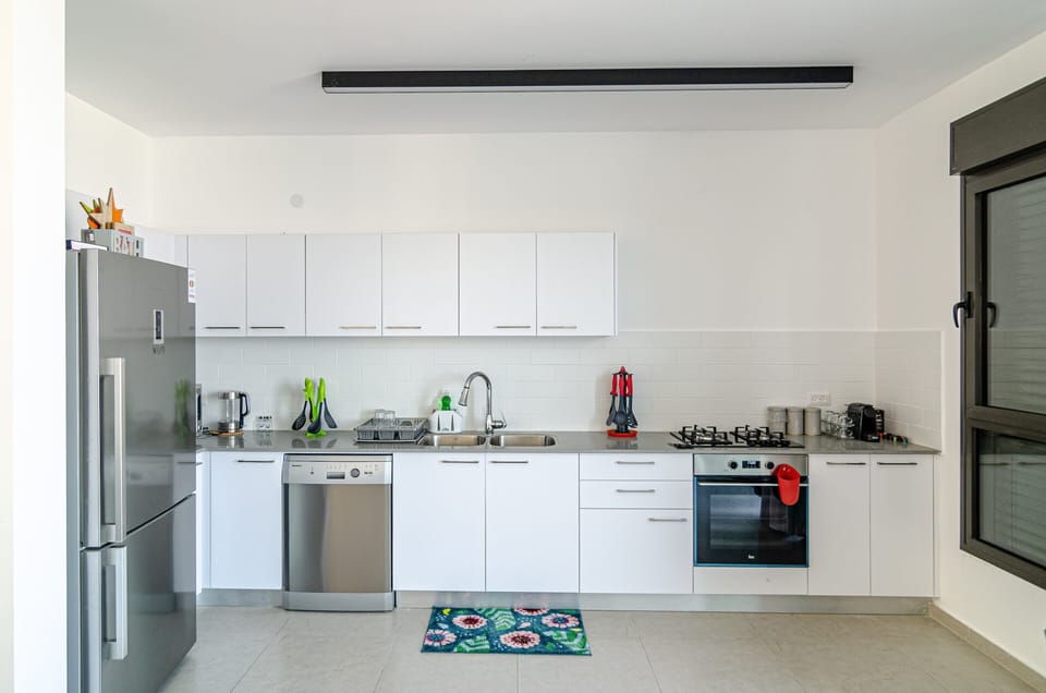 Luxury Apartment | Private kitchen | Full-size fridge, microwave, oven, stovetop