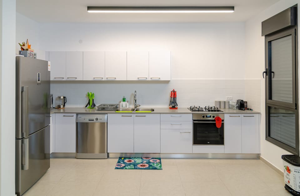 Luxury Apartment | Private kitchen | Full-size fridge, microwave, oven, stovetop