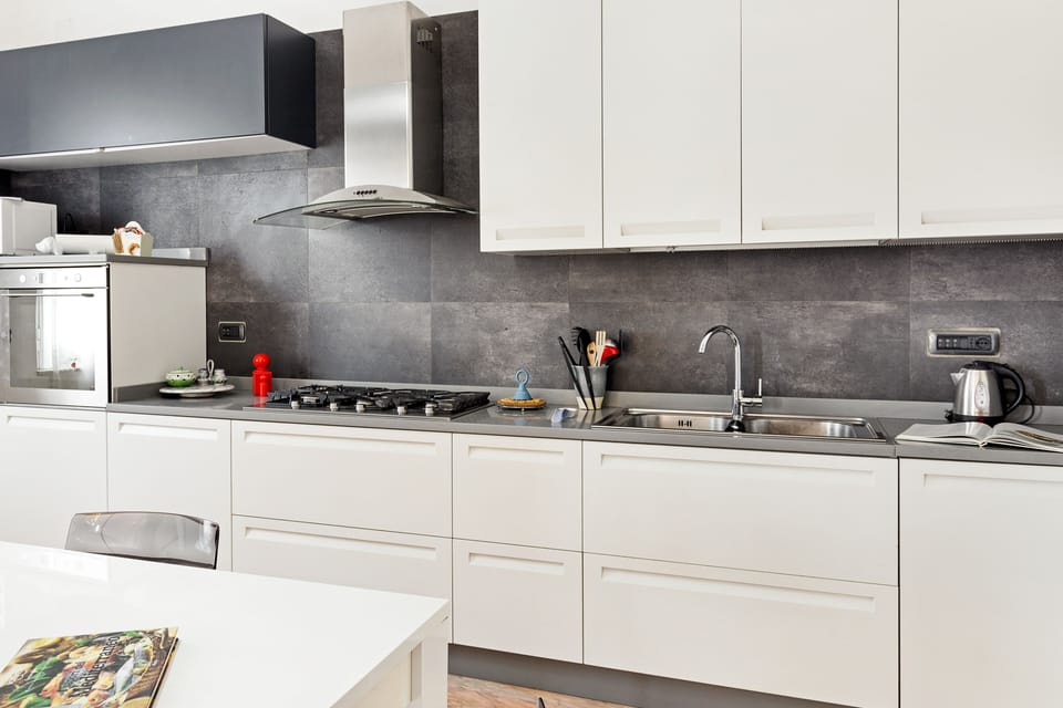 Apartment, 4 Bedrooms | Private kitchen | Full-size fridge, microwave, oven, stovetop