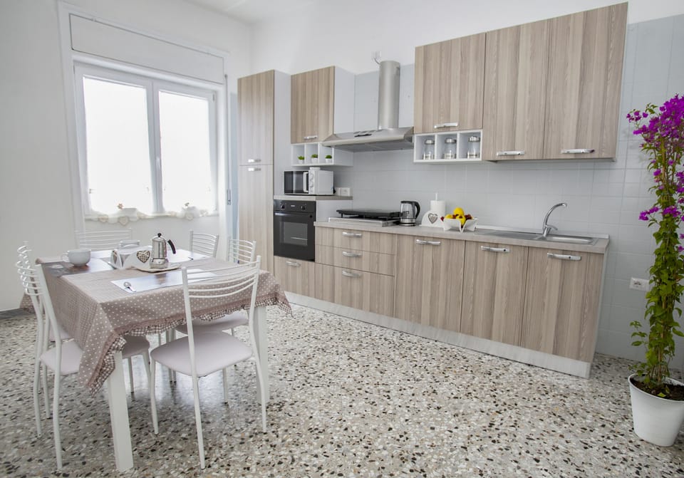 Apartment, 2 Bedrooms | Private kitchen | Full-size fridge, microwave, oven, stovetop