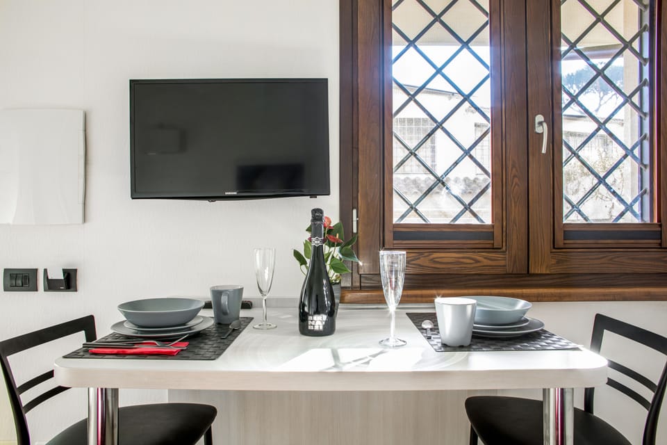 Superior Apartment | Living area | 24-inch flat-screen TV with cable channels, TV