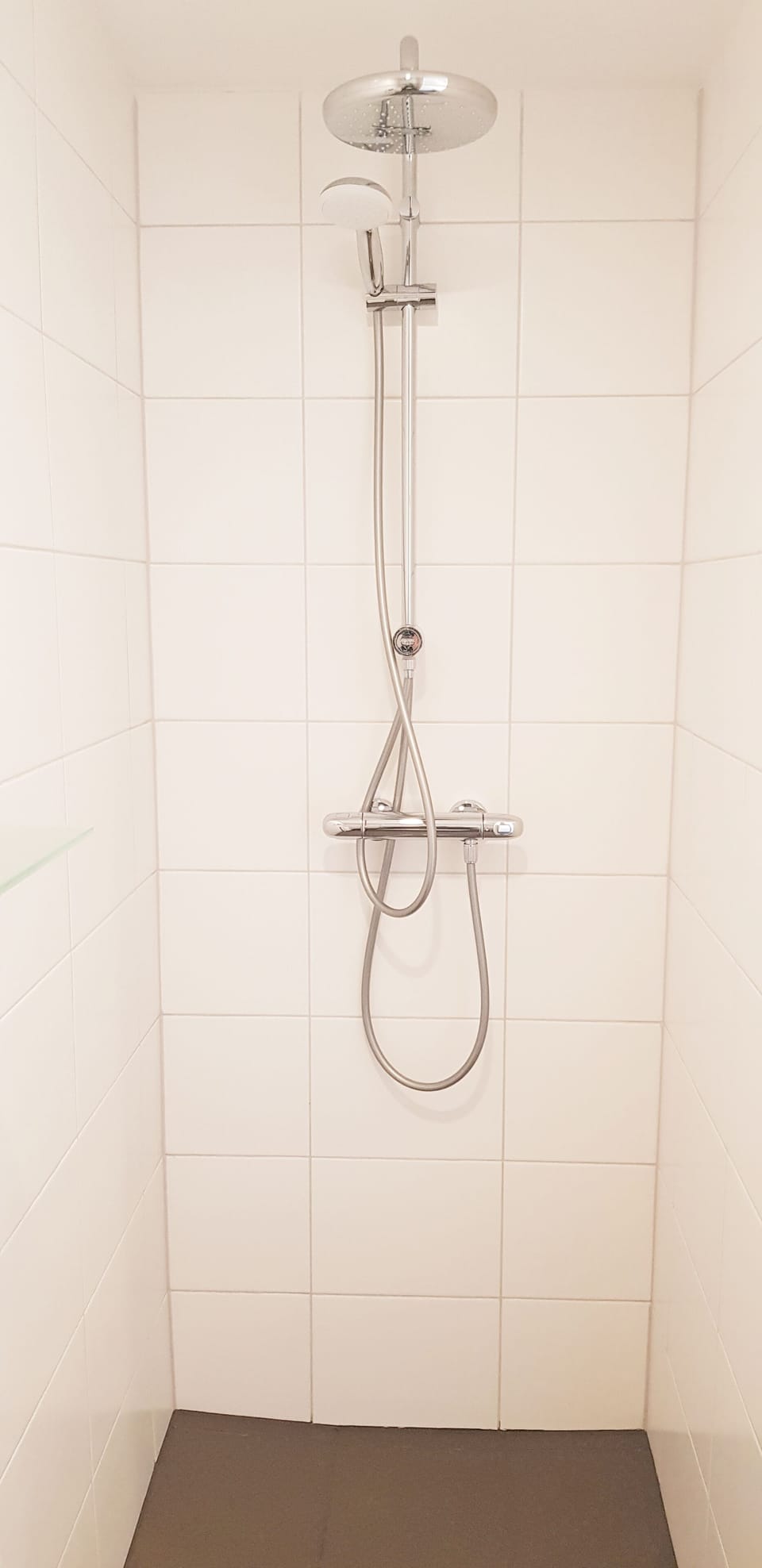 Shower, rainfall showerhead, hair dryer, towels