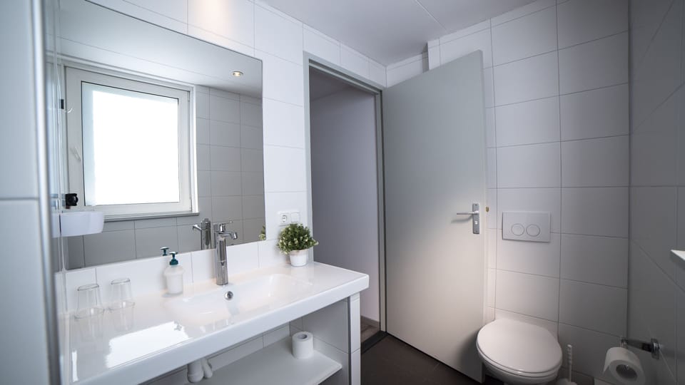 Shower, rainfall showerhead, hair dryer, towels