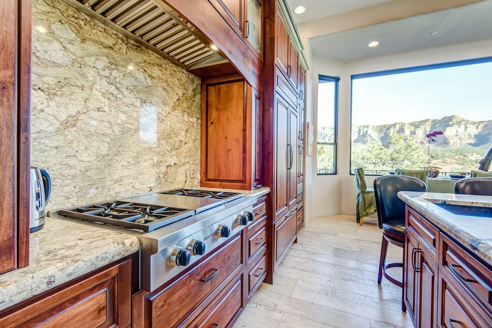 Gourmet Kitchen with Stainless Steel Appliances, Including a 6-Burner Stovetop, and Double Convection/Steam Ovens