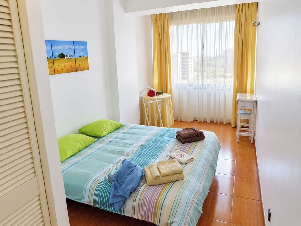 Double bedroom with fresh linens, wardrobe storage and natural light.