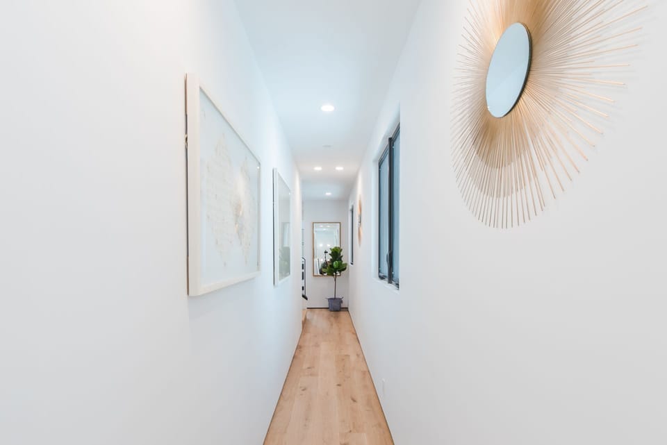 Second level hallway connects the main stairway to two bedrooms and one bath.
                