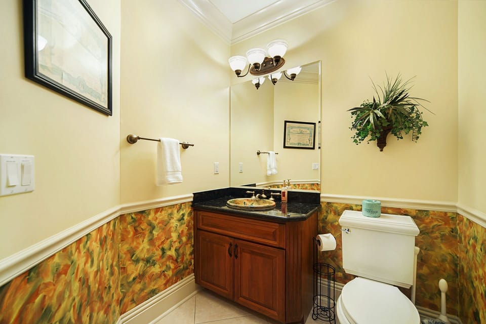 Even the powder room makes a statement — thoughtfully appointed and conveniently located off the great room.