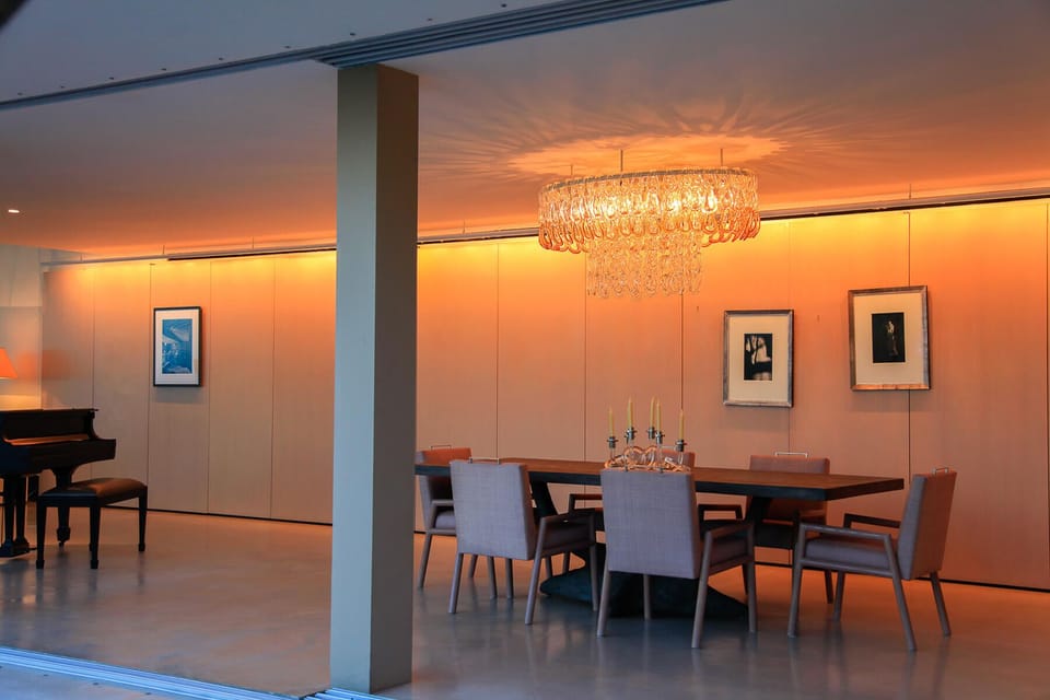 Dine under the grand chandelier in the luxury dining area
