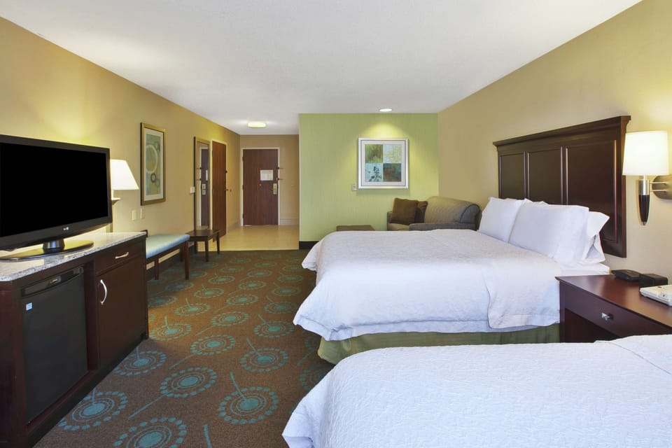 Premium bedding, pillowtop beds, desk, laptop workspace