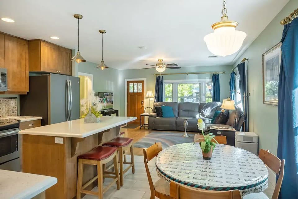 Open concept with living room, dining, and kitchen