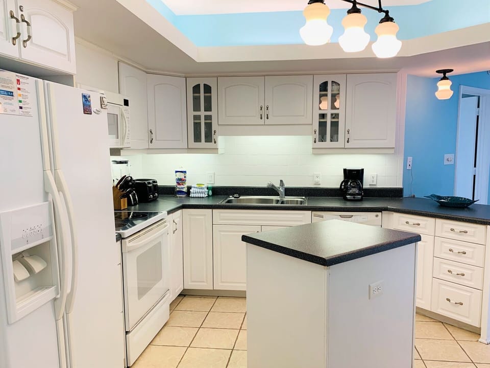 Condo, 3 Bedrooms, Balcony, Beachfront (1104A) | Private kitchen | Full-size fridge, microwave, oven, stovetop