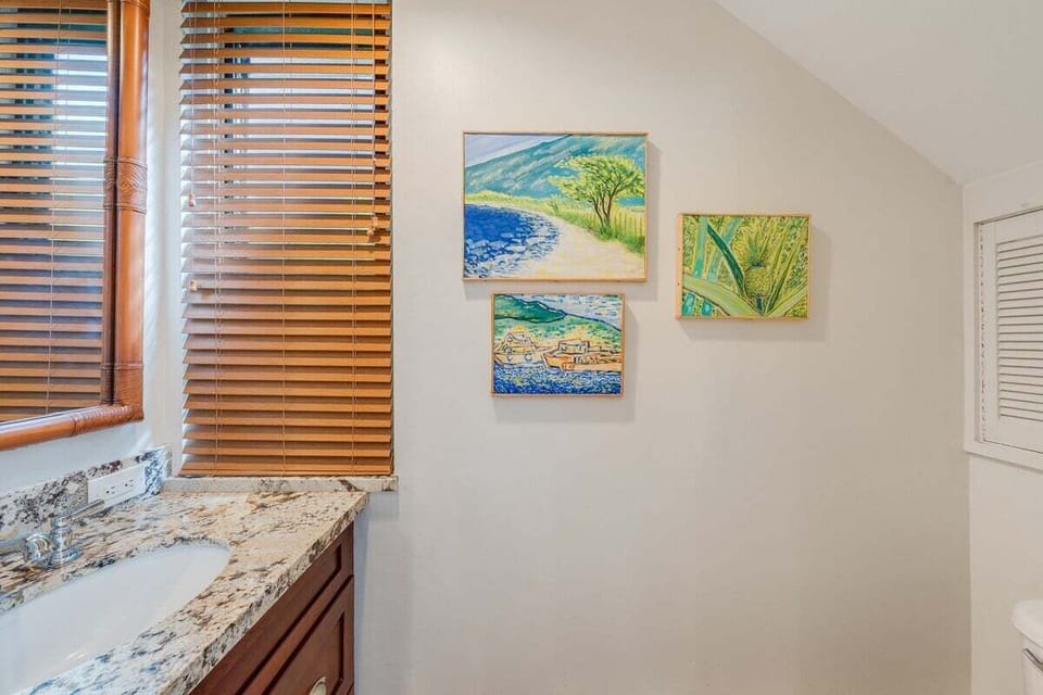 Stay in a stylish retreat with a modern vanity and vibrant accents.