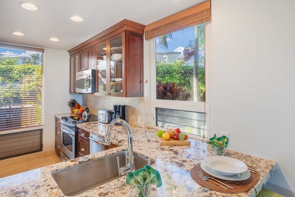 Relax in a stylish kitchen with a breakfast bar and elegant finishes.