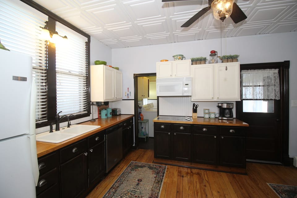 Kitchen towards Laundry Room (doorway on left) and back porch (doorway on right)
