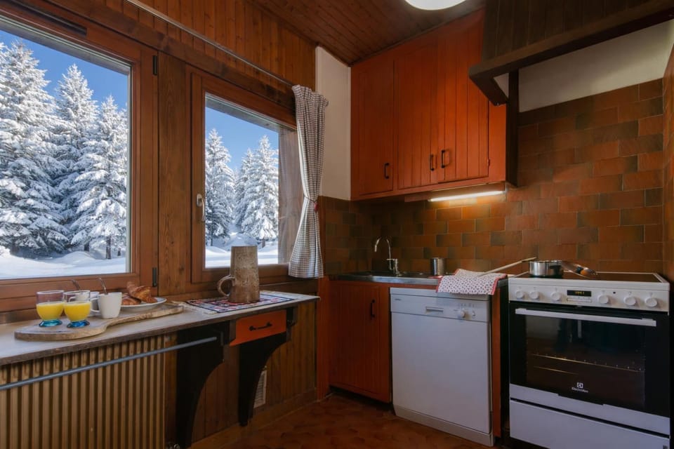 Kitchen with full size oven, dishwasher and a microwave