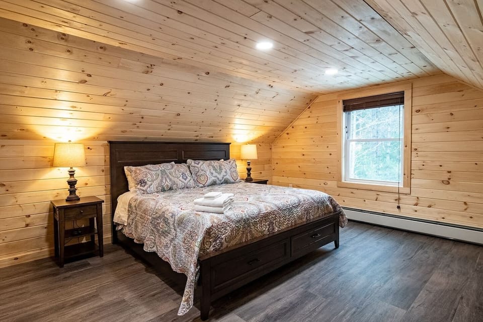 Bedroom 4 is spacious with knotty pine finishing. 