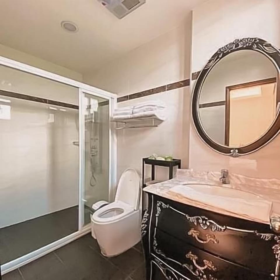 Shower, hair dryer, slippers, towels