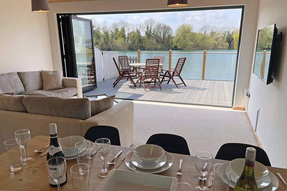 Ground floor: Open plan living area with bifold doors onto a private deck